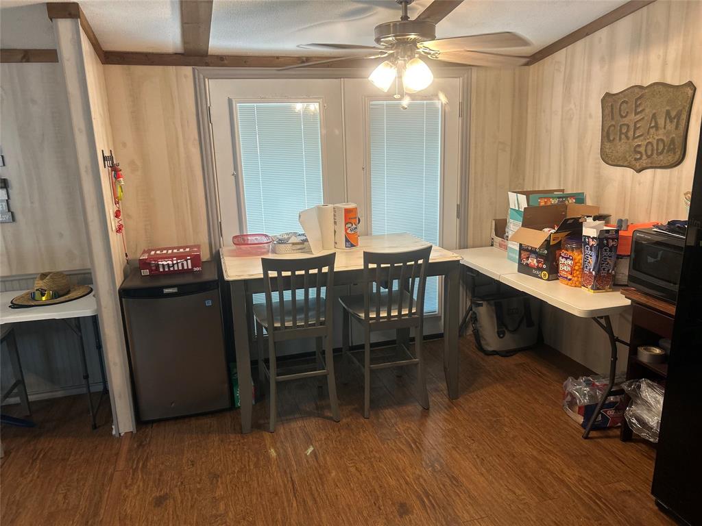4705 Fox Hollow Road Graham, TX 76450 - Photo 27 of 28 a dining room with furniture and wooden floor