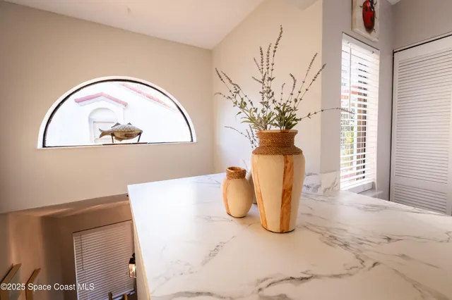 a vase of flowers sitting on a table