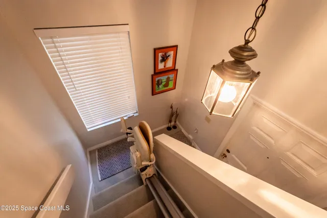 a room with wooden floor and windows