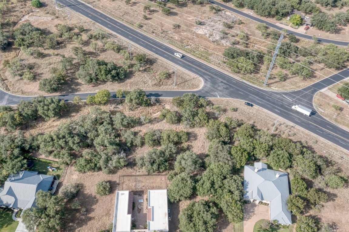 Tbd Hi Circle North Horseshoe Bay, TX 78657 - Photo 18 of 19 a view of a yard with a wooden fence