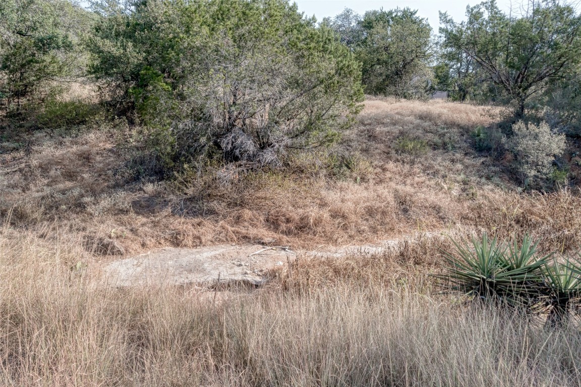 Tbd Hi Circle North Horseshoe Bay, TX 78657 - Photo 5 of 19 a view of a dry yard with trees