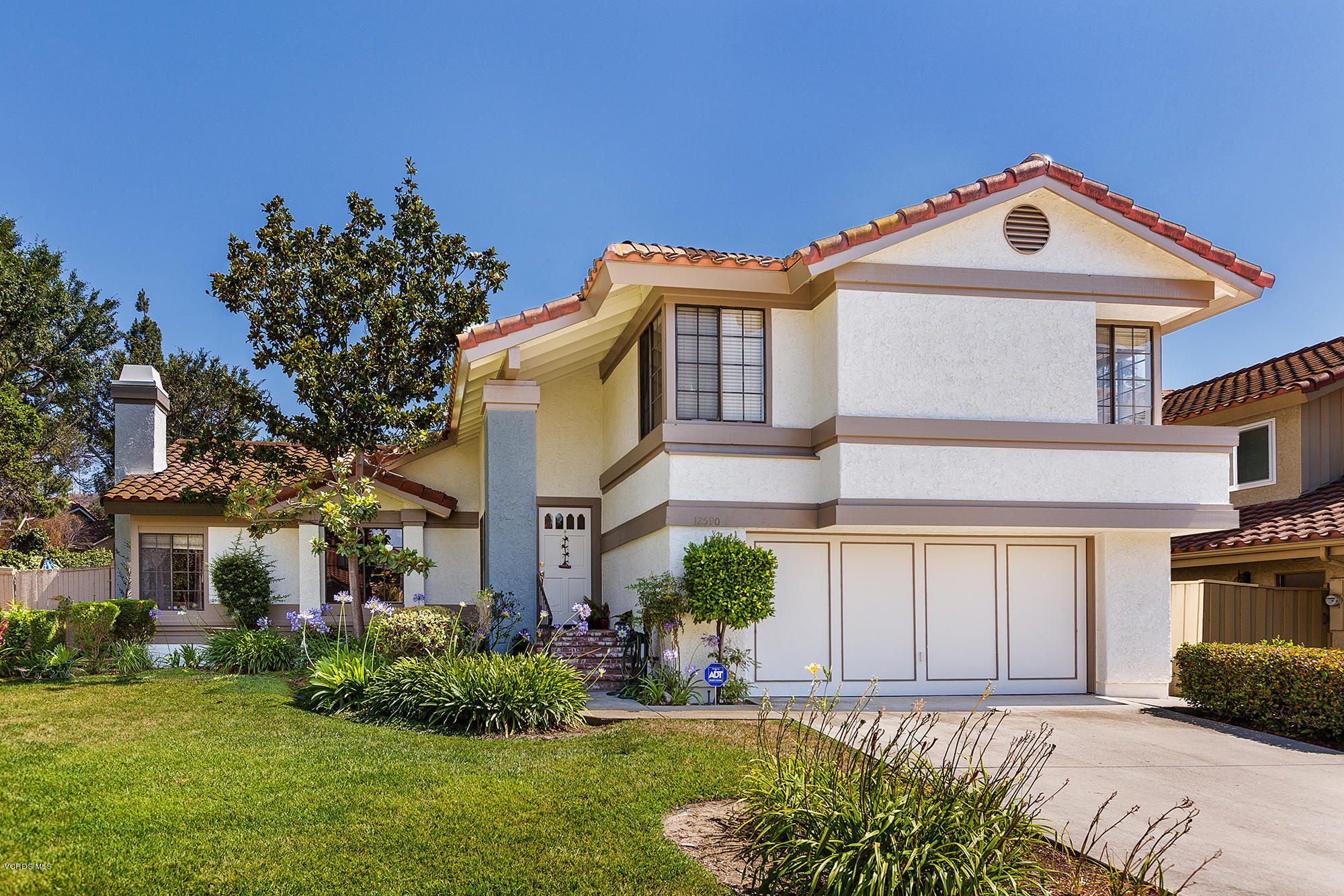12590 Crystal Ranch Road Moorpark, CA 93021 - Photo 1 of 21 a front view of a house with a yard