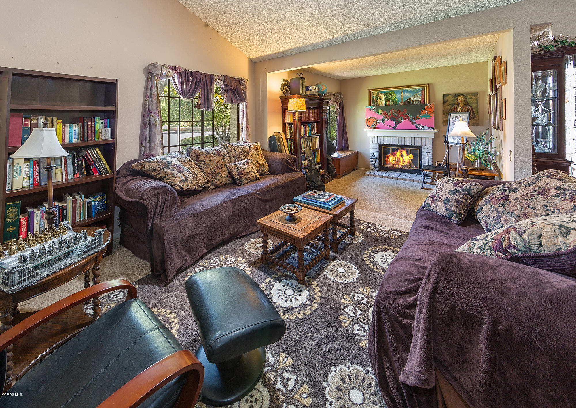 12590 Crystal Ranch Road Moorpark, CA 93021 - Photo 2 of 21 a living room with furniture and a flat screen tv