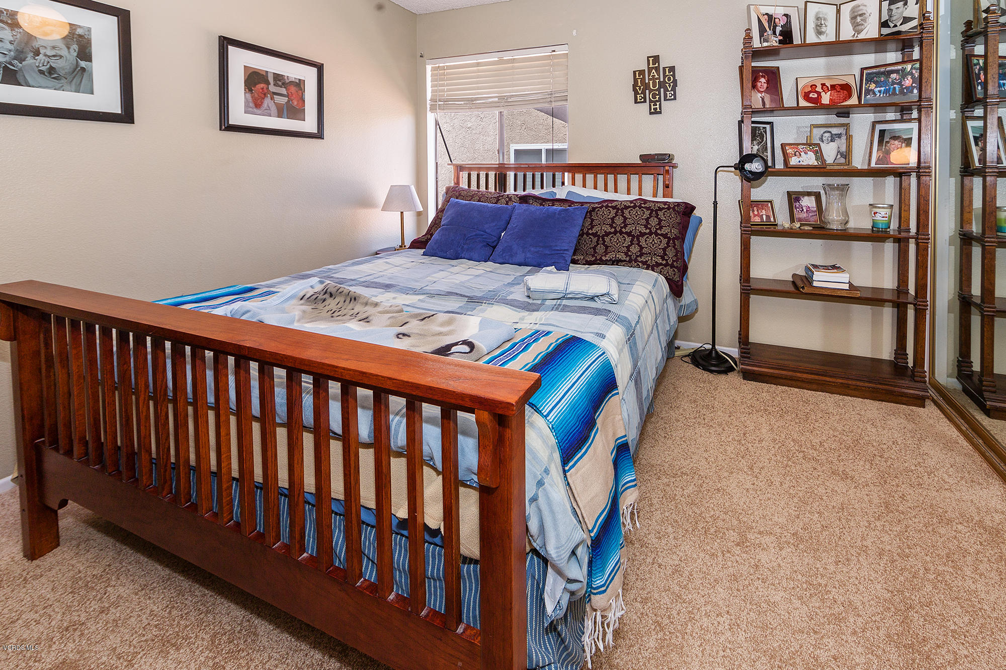 12590 Crystal Ranch Road Moorpark, CA 93021 - Photo 11 of 21 a bedroom with a bed and book shelf