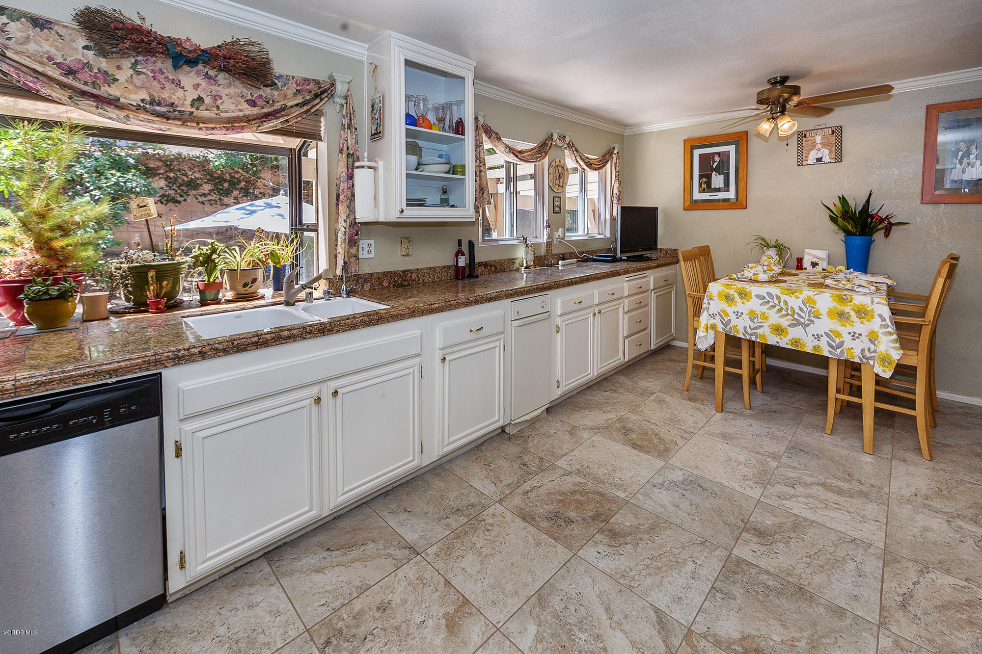 12590 Crystal Ranch Road Moorpark, CA 93021 - Photo 5 of 21 a large white kitchen with a large window