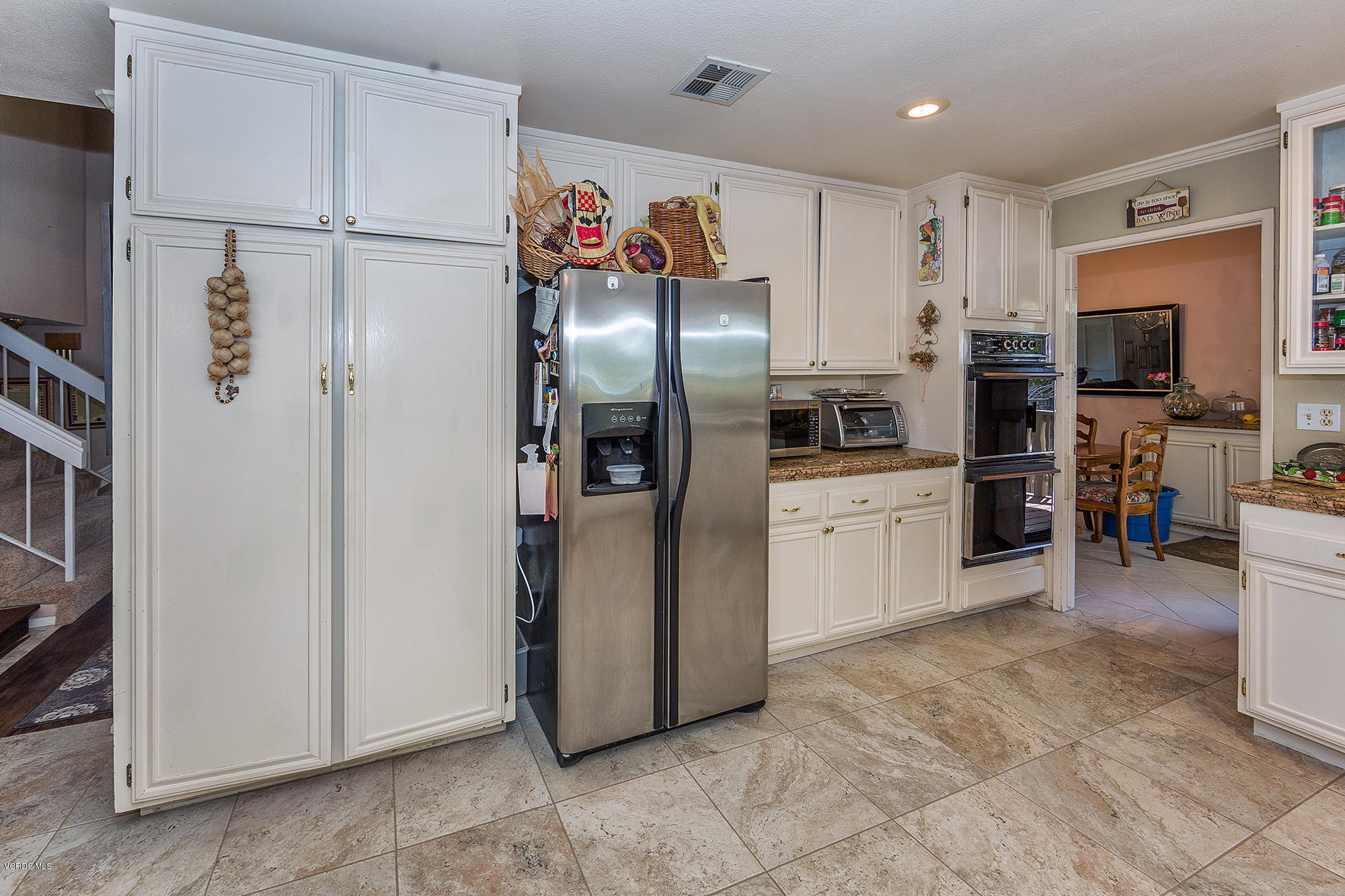 12590 Crystal Ranch Road Moorpark, CA 93021 - Photo 6 of 21 a kitchen with stainless steel appliances a refrigerator sink and microwave