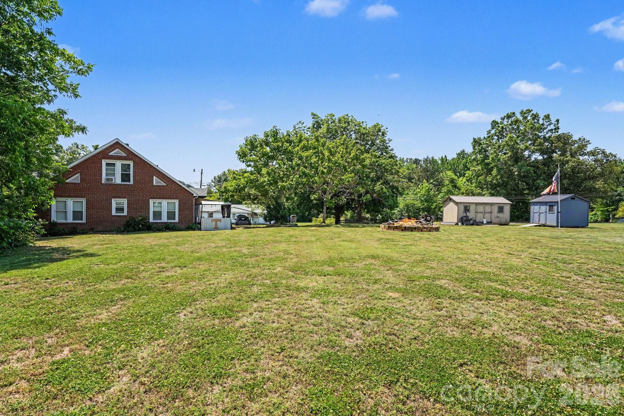24359 Ridgecrest Road Locust, NC 28097 - Photo 25 of 26 a front view of a house with a yard
