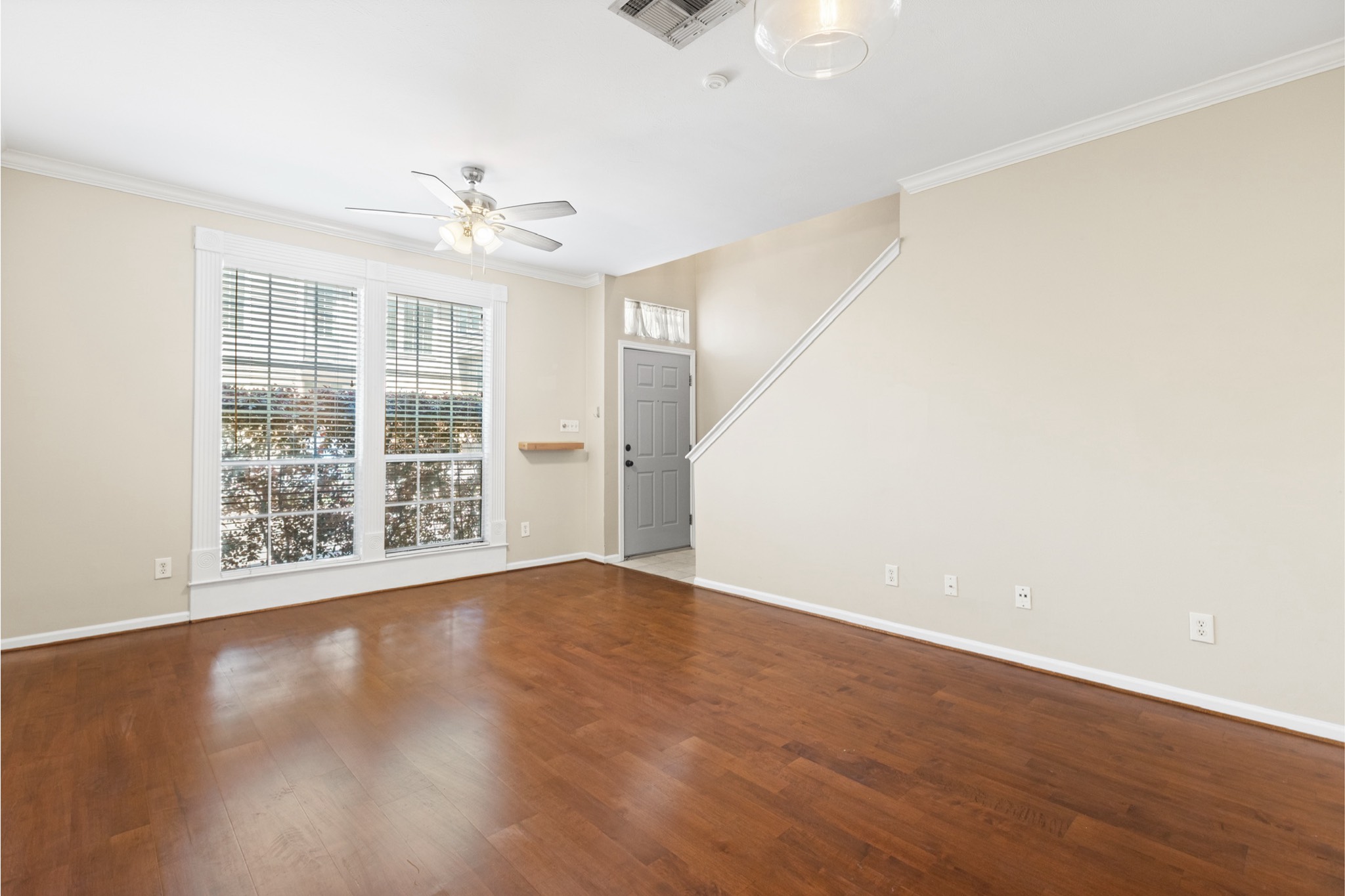 1708 Dennis Street Houston, TX 77004 - Photo 5 of 20 wooden floor in an empty room with a window