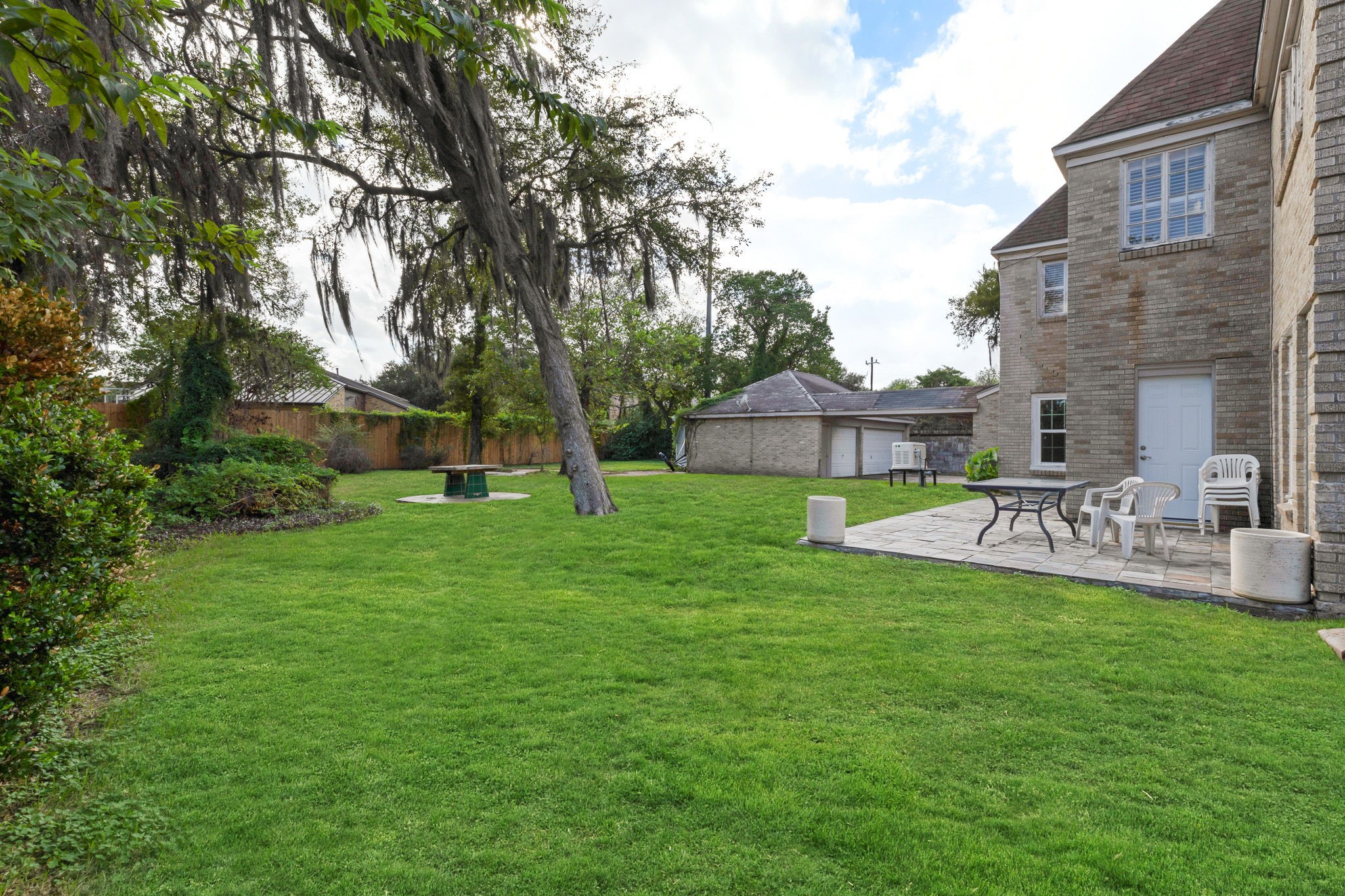 3620 South MacGregor Way Houston, TX 77021 - Photo 21 of 21 a view of a house with backyard and a sitting area