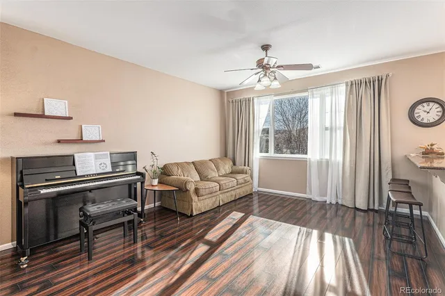 a living room with furniture and a window