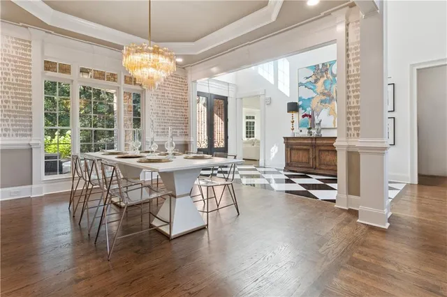 a large kitchen with stainless steel appliances granite countertop a stove a sink a refrigerator and a wooden cabinets