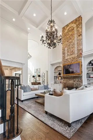 a large kitchen with granite countertop a sink and dishwasher a stove with wooden floor