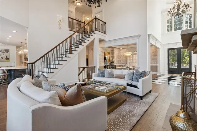 a kitchen with stainless steel appliances a stove top oven and a wooden floor