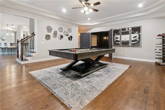 a living room with granite countertop furniture and a flat screen tv