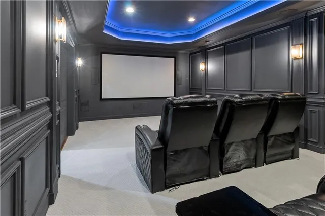 an aerial view of residential house with outdoor space and trees all around