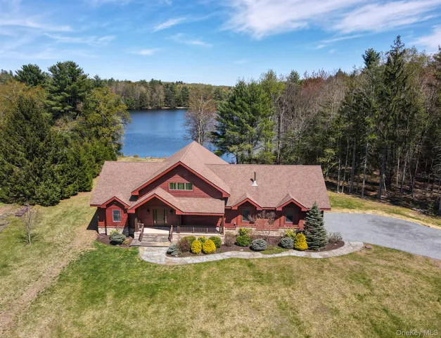 a hallway with a large kitchen view and a refrigerator