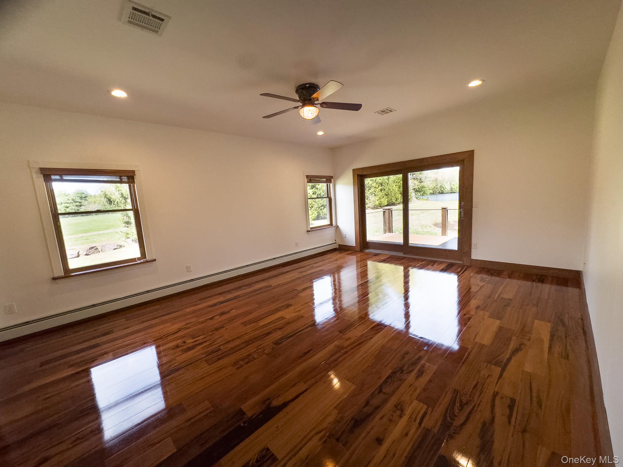 58 Deer Meadow Road Bethel, NY 12786 - Photo 18 of 29 a view of empty room with wooden floor and fan