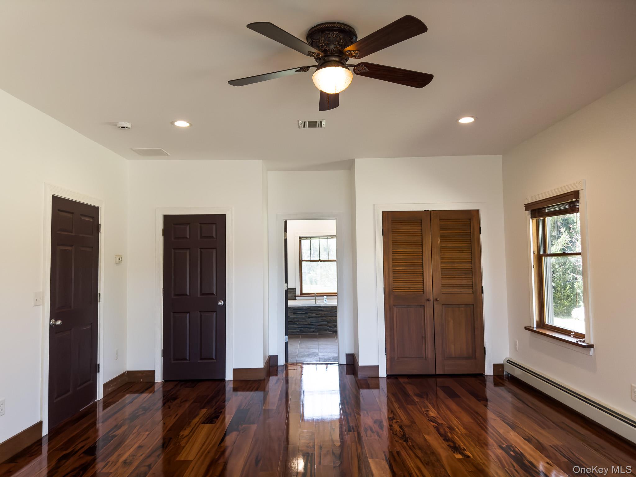 58 Deer Meadow Road Bethel, NY 12786 - Photo 19 of 29 a view of empty room with wooden floor and fan