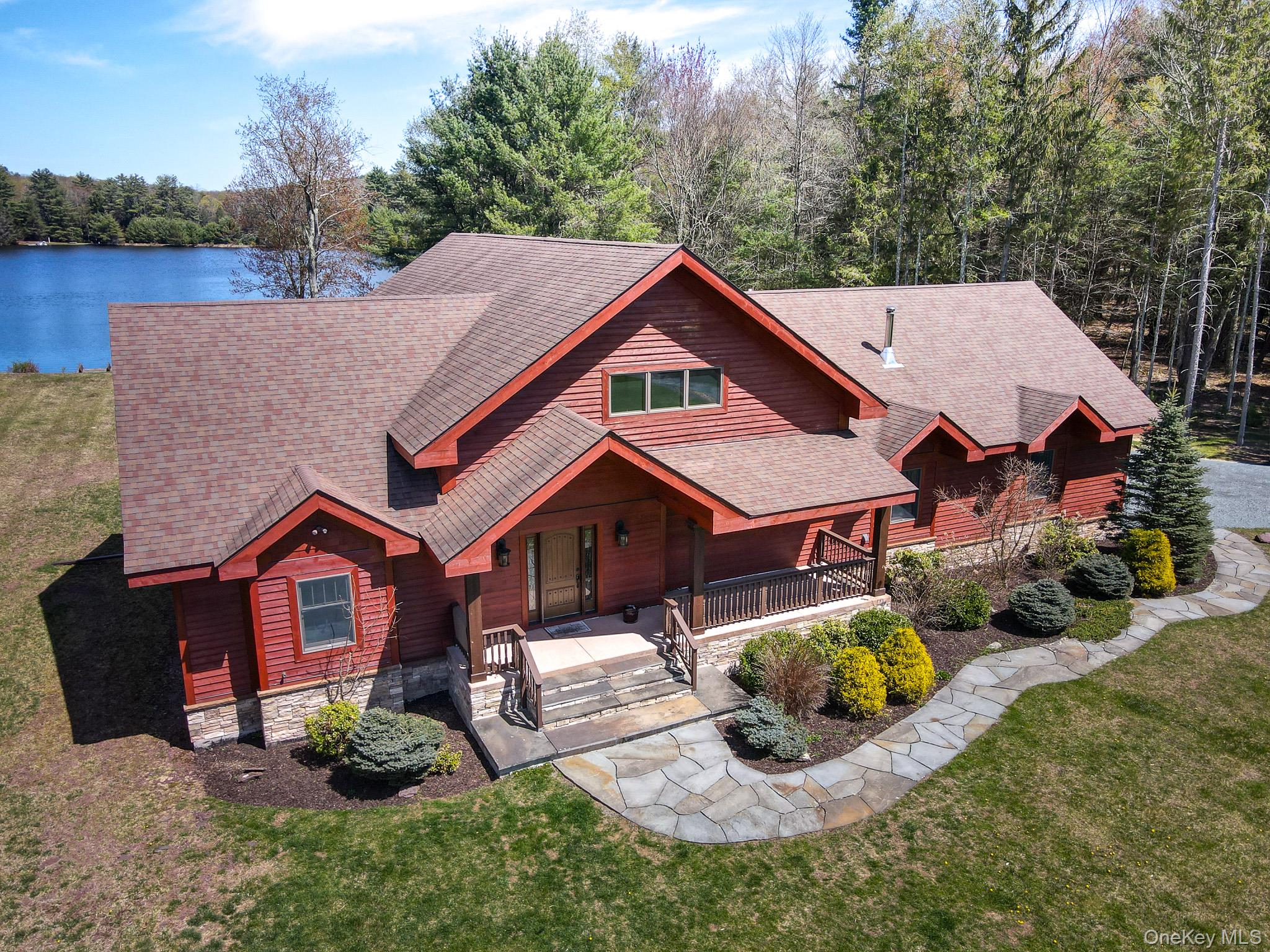 58 Deer Meadow Road Bethel, NY 12786 - Photo 2 of 29 a aerial view of a house with a yard and potted plants