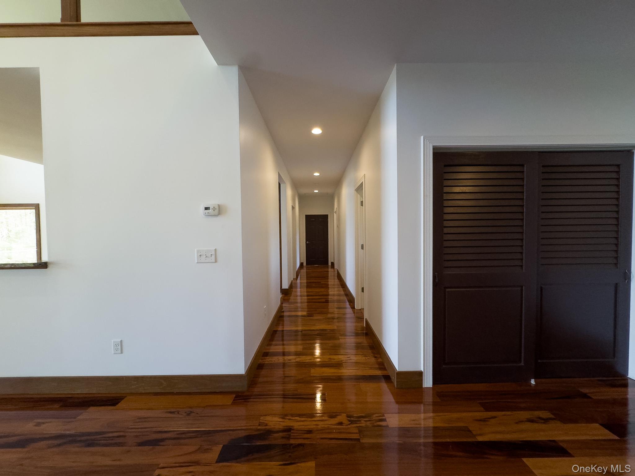 58 Deer Meadow Road Bethel, NY 12786 - Photo 26 of 29 a view of a hallway with wooden floor and closet