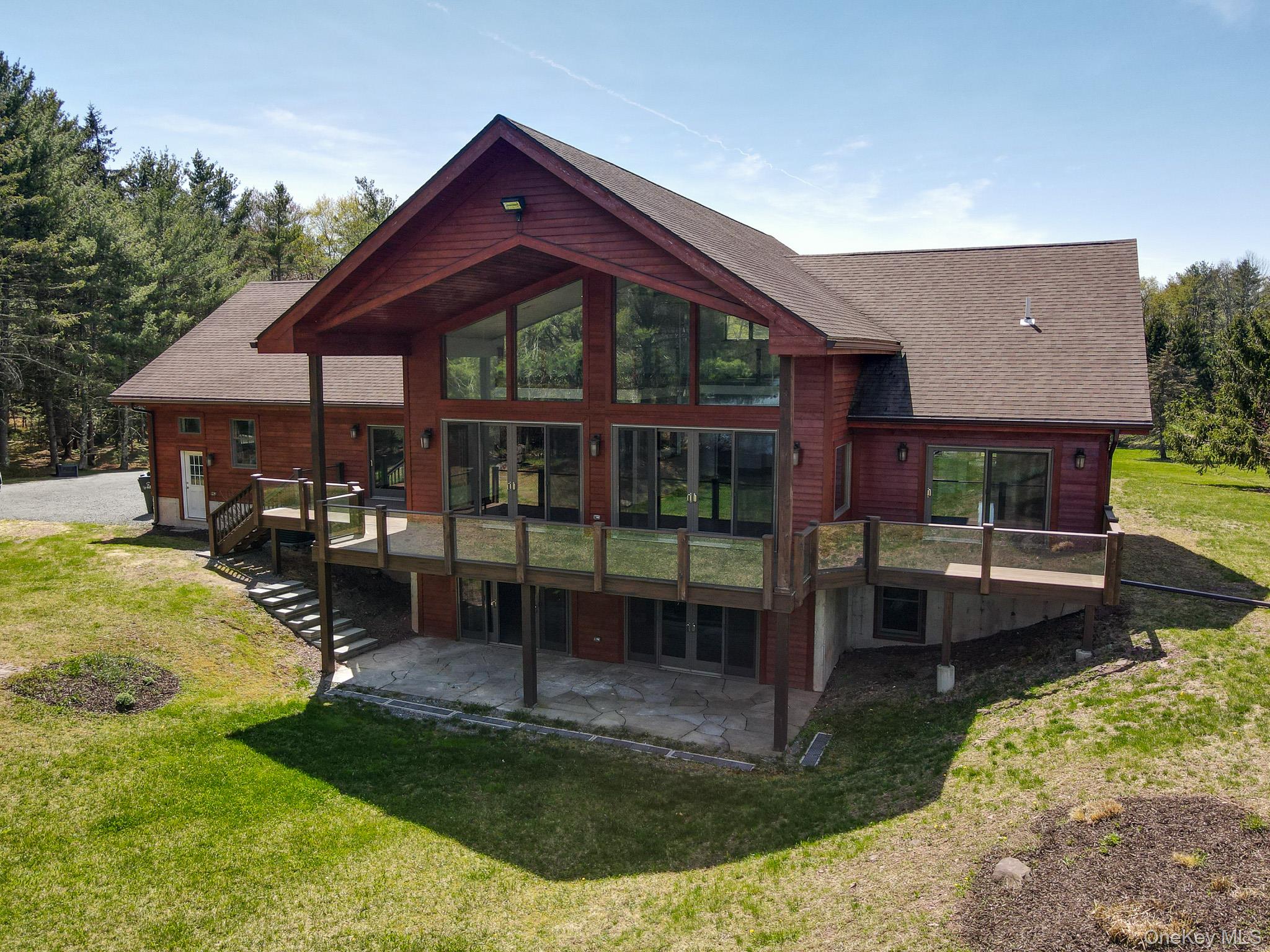 58 Deer Meadow Road Bethel, NY 12786 - Photo 3 of 29 a front view of a house with garden