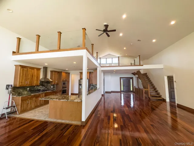 a view of a lake with table and chairs
