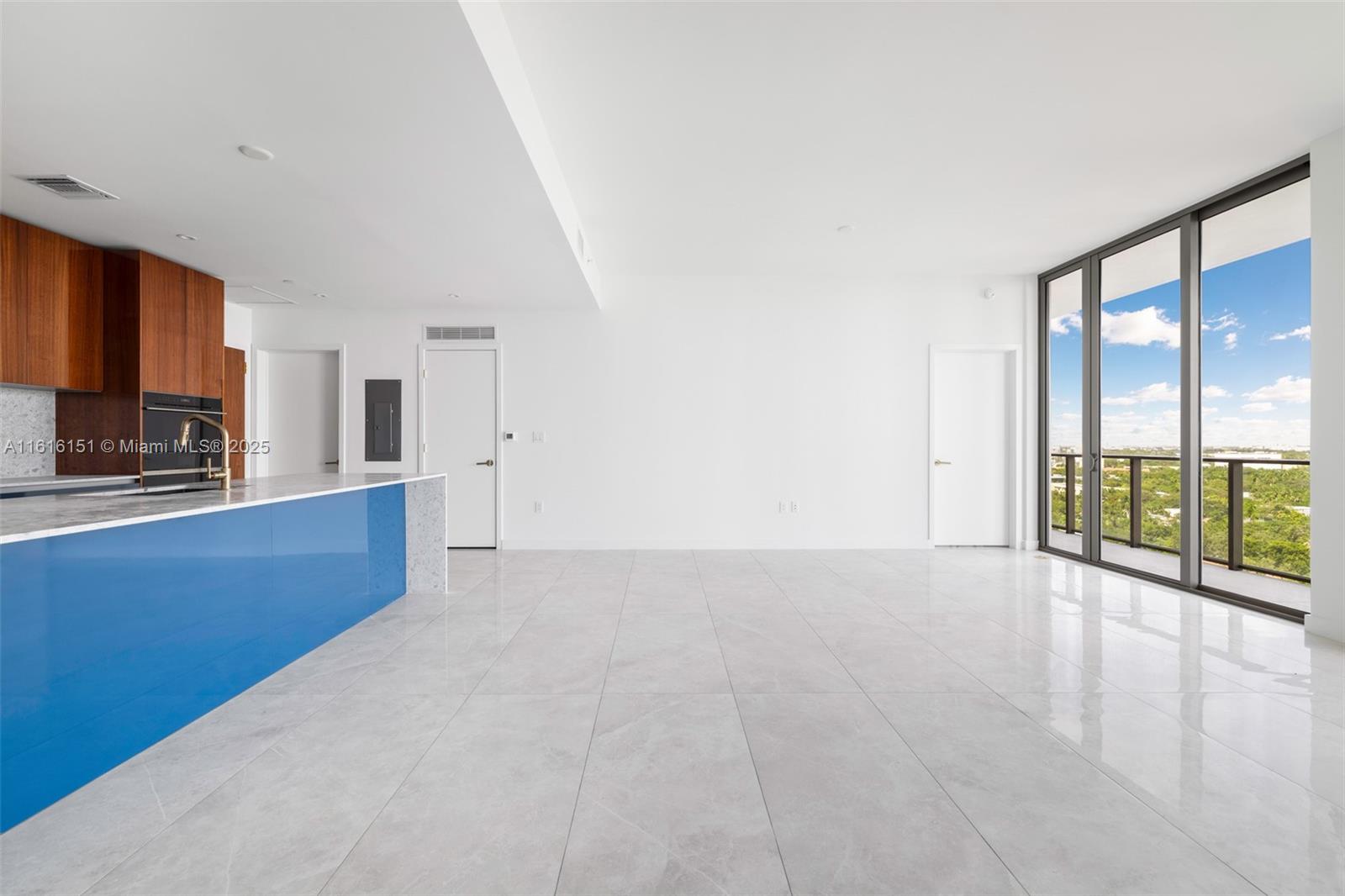 2678 Tigertail Avenue, Unit 1104 Miami, FL 33133 - Photo 14 of 65 a view of an empty room with a window