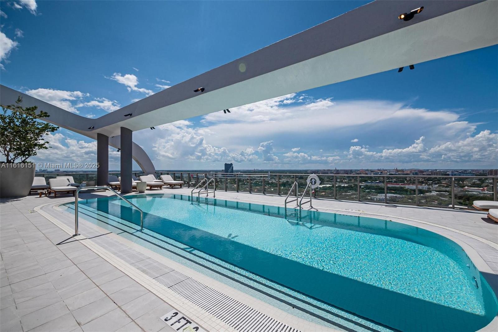 2678 Tigertail Avenue, Unit 1104 Miami, FL 33133 - Photo 53 of 65 a view of a swimming pool and an outdoor seating