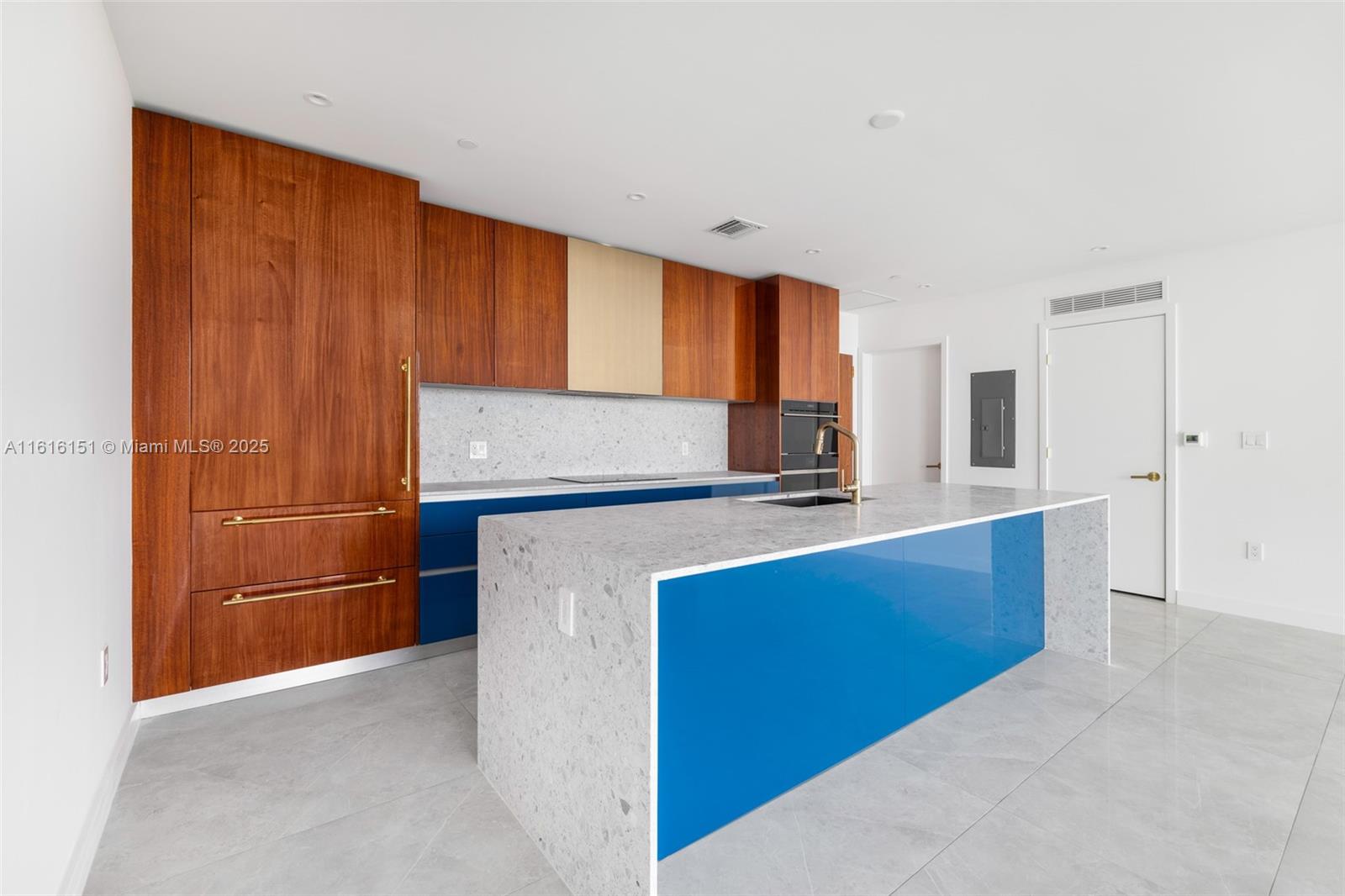 2678 Tigertail Avenue, Unit 1104 Miami, FL 33133 - Photo 6 of 65 a kitchen with stainless steel appliances granite countertop a refrigerator and a sink