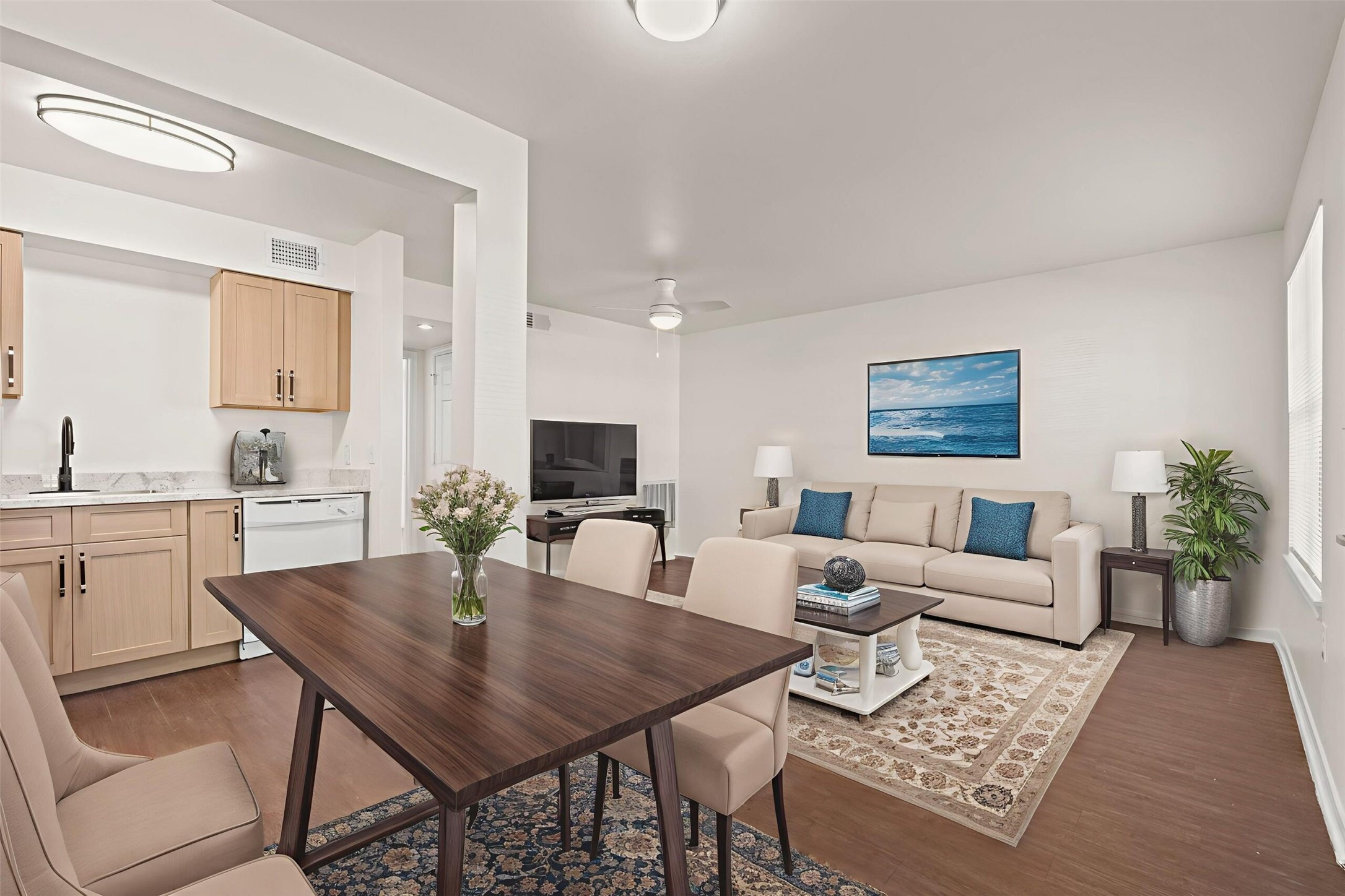 8210 Bauman Road, Unit 40 Houston, TX 77022 - Photo 5 of 10 a living room with furniture a flat screen tv and a table