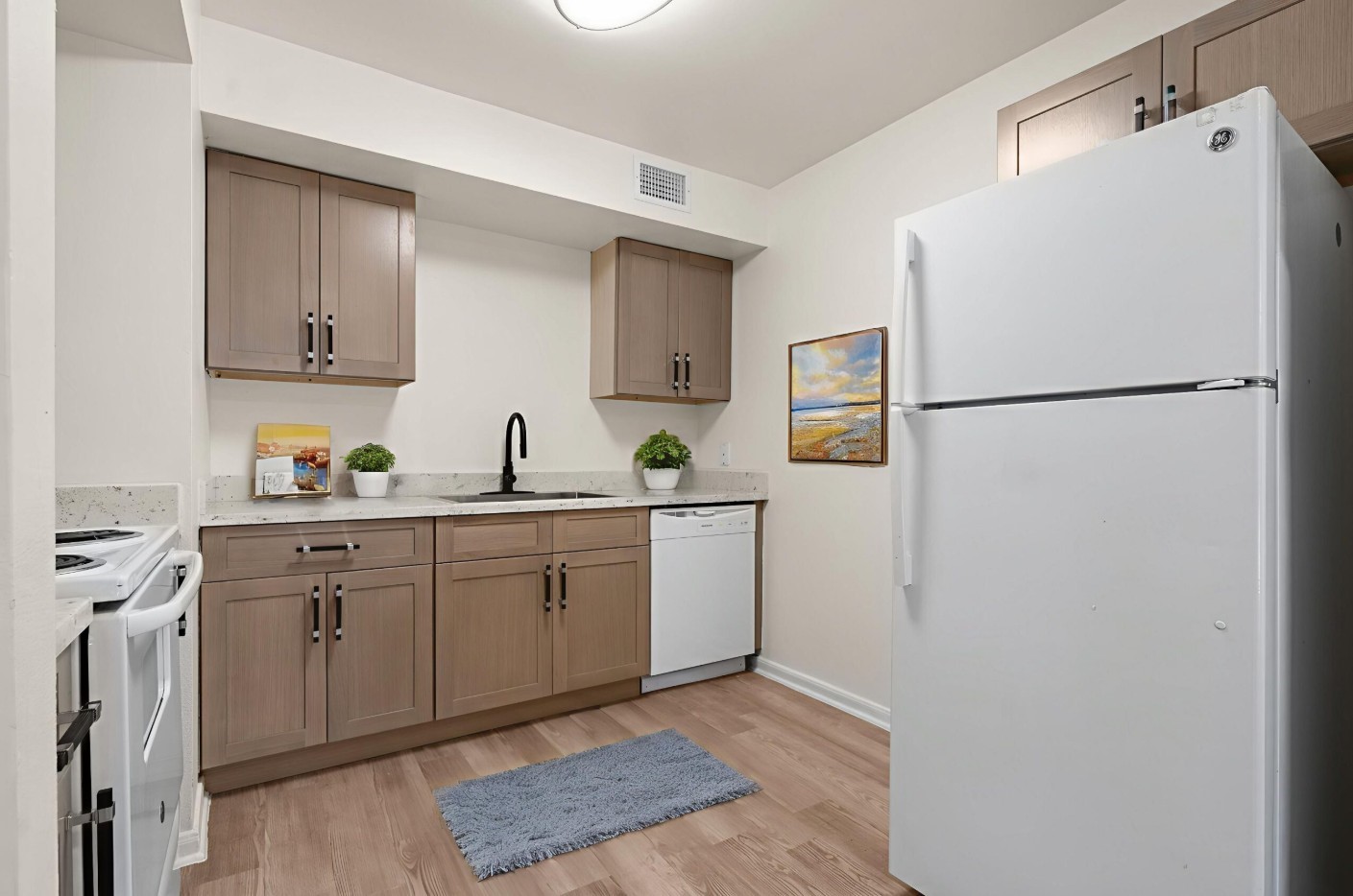 8210 Bauman Road, Unit 40 Houston, TX 77022 - Photo 6 of 10 a white refrigerator freezer sitting inside of a kitchen
