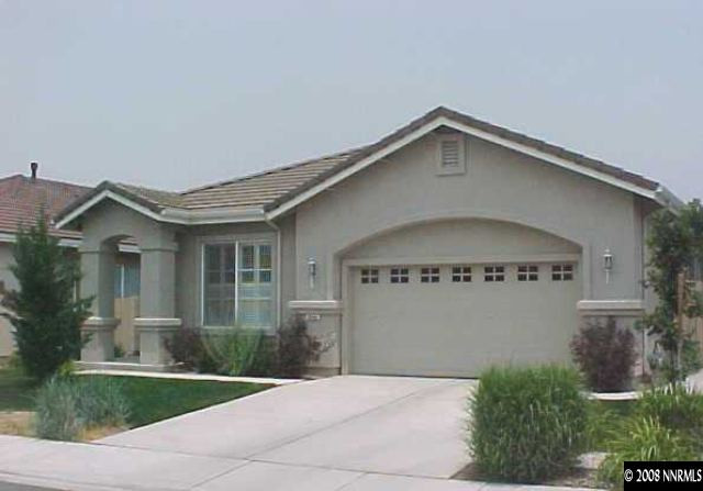 10080 Zephyr Heights Drive Reno, NV 89521 - Photo 1 of 9 a front view of a house with yard