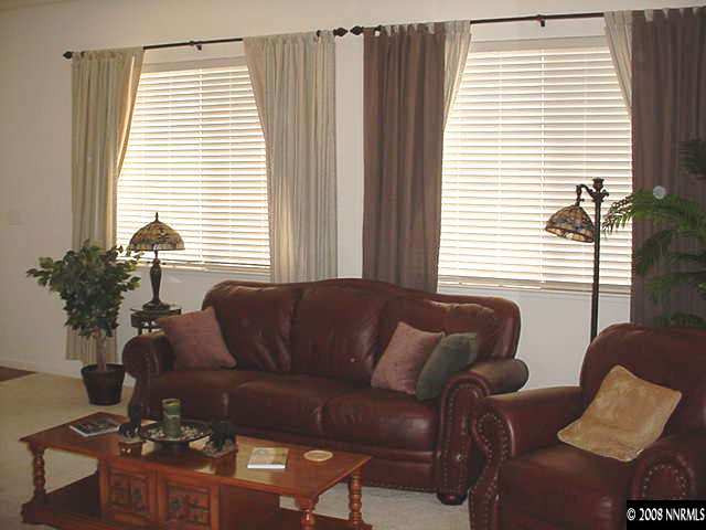 10080 Zephyr Heights Drive Reno, NV 89521 - Photo 3 of 9 a living room with furniture and a window