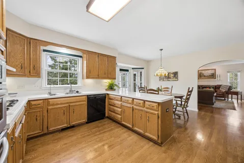 a kitchen with wooden cabinets and sink