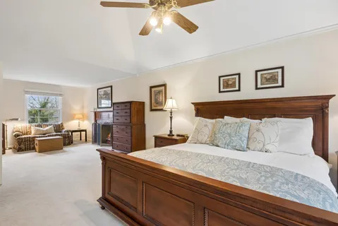 a spacious bedroom with a bed and furniture