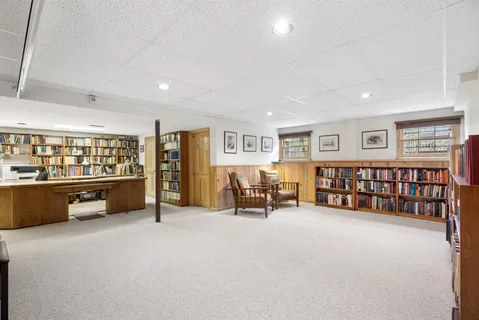 a living room with furniture and large window