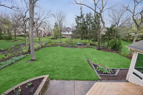 a view of a wooden deck with a yard