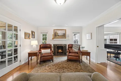 a living room with furniture and a fireplace