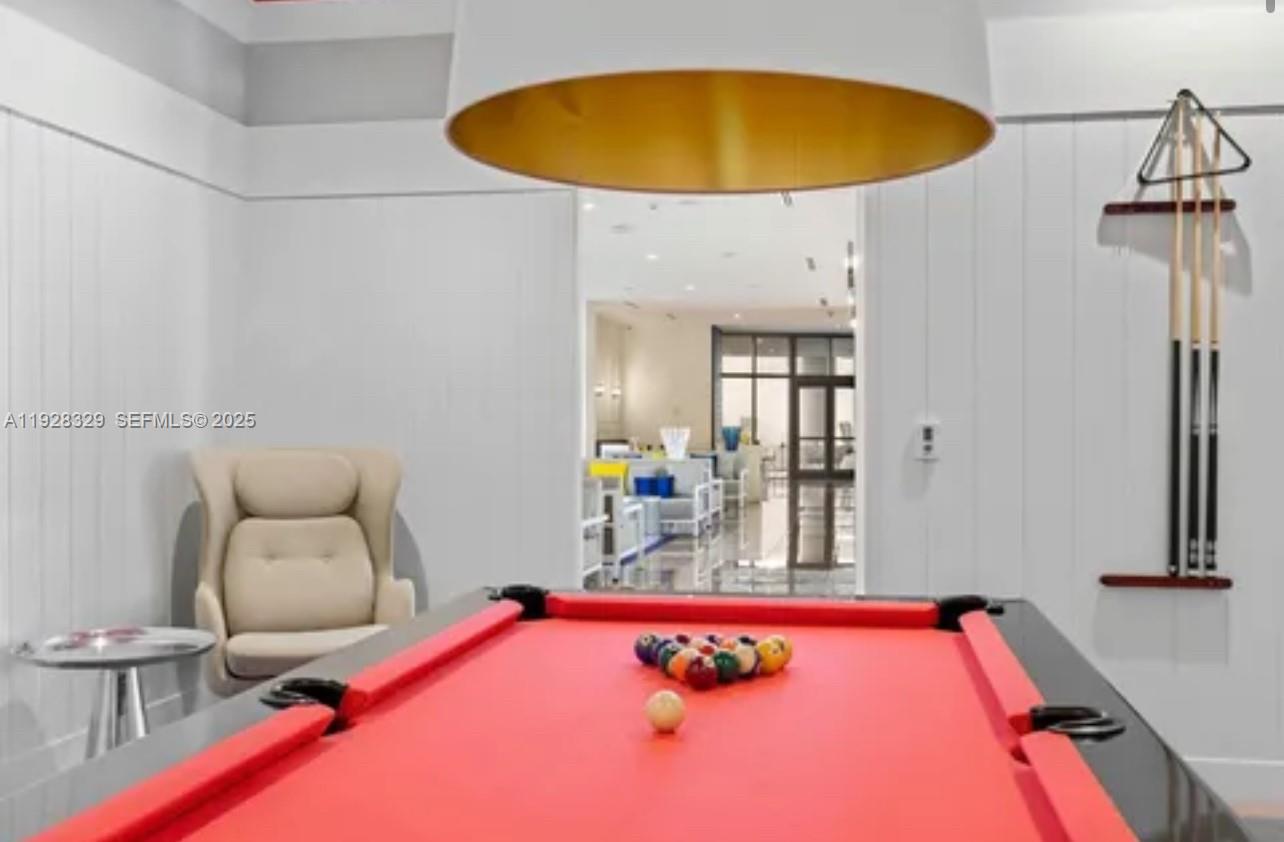 2000 Metropica Way, Unit 1701 Sunrise, FL 33323 - Photo 13 of 32 a room with furniture and a table