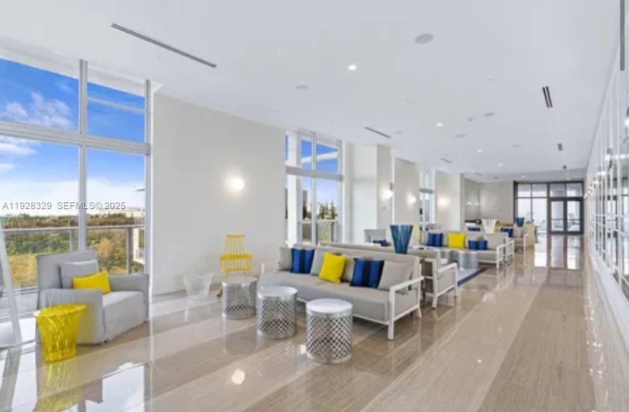 2000 Metropica Way, Unit 1701 Sunrise, FL 33323 - Photo 15 of 32 a living room with furniture and breakfast area