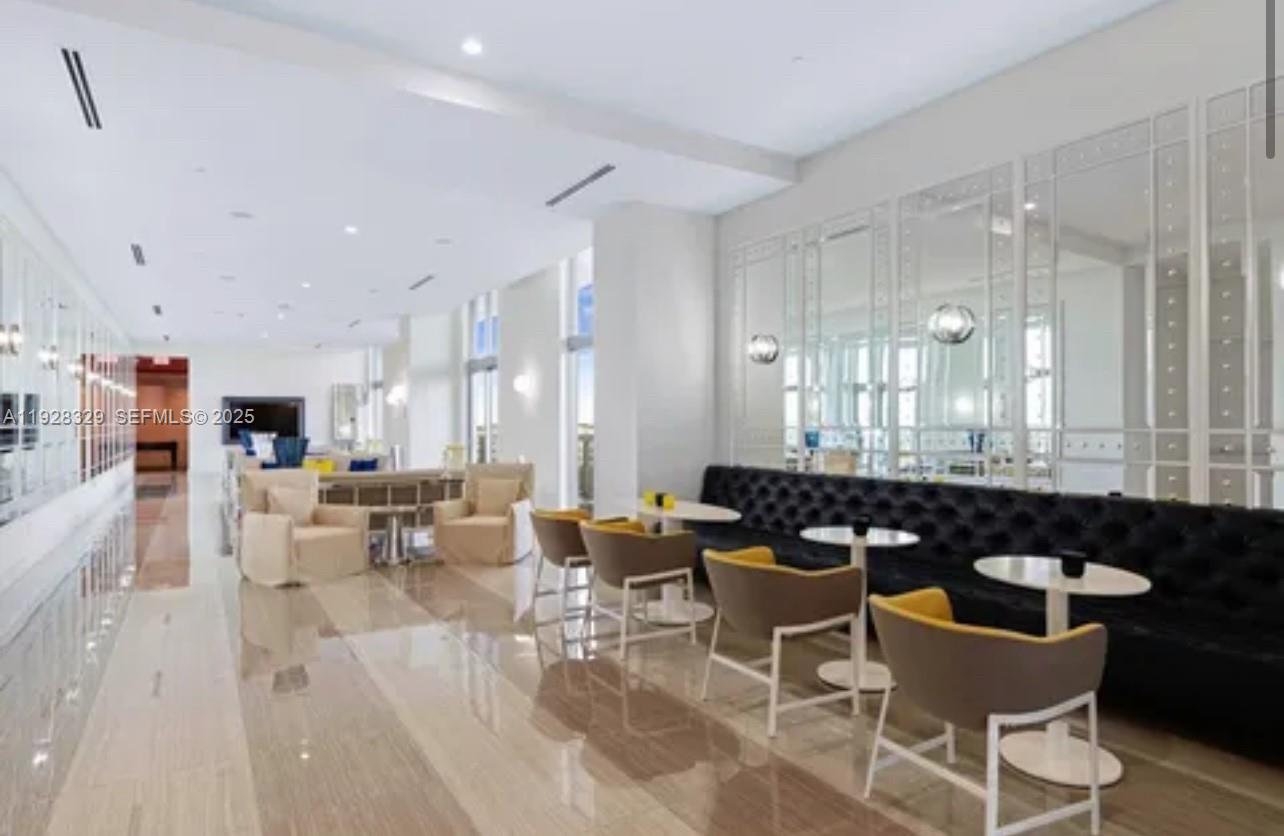 2000 Metropica Way, Unit 1701 Sunrise, FL 33323 - Photo 17 of 32 a large dining space with furniture