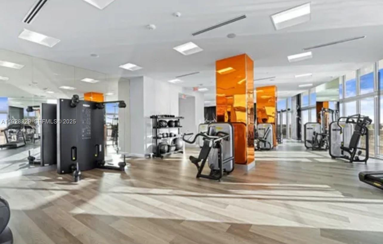 2000 Metropica Way, Unit 1701 Sunrise, FL 33323 - Photo 19 of 32 a view of a room with gym equipment