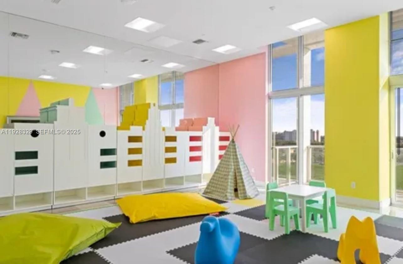 2000 Metropica Way, Unit 1701 Sunrise, FL 33323 - Photo 20 of 32 a view of a swimming pool with outdoor seating