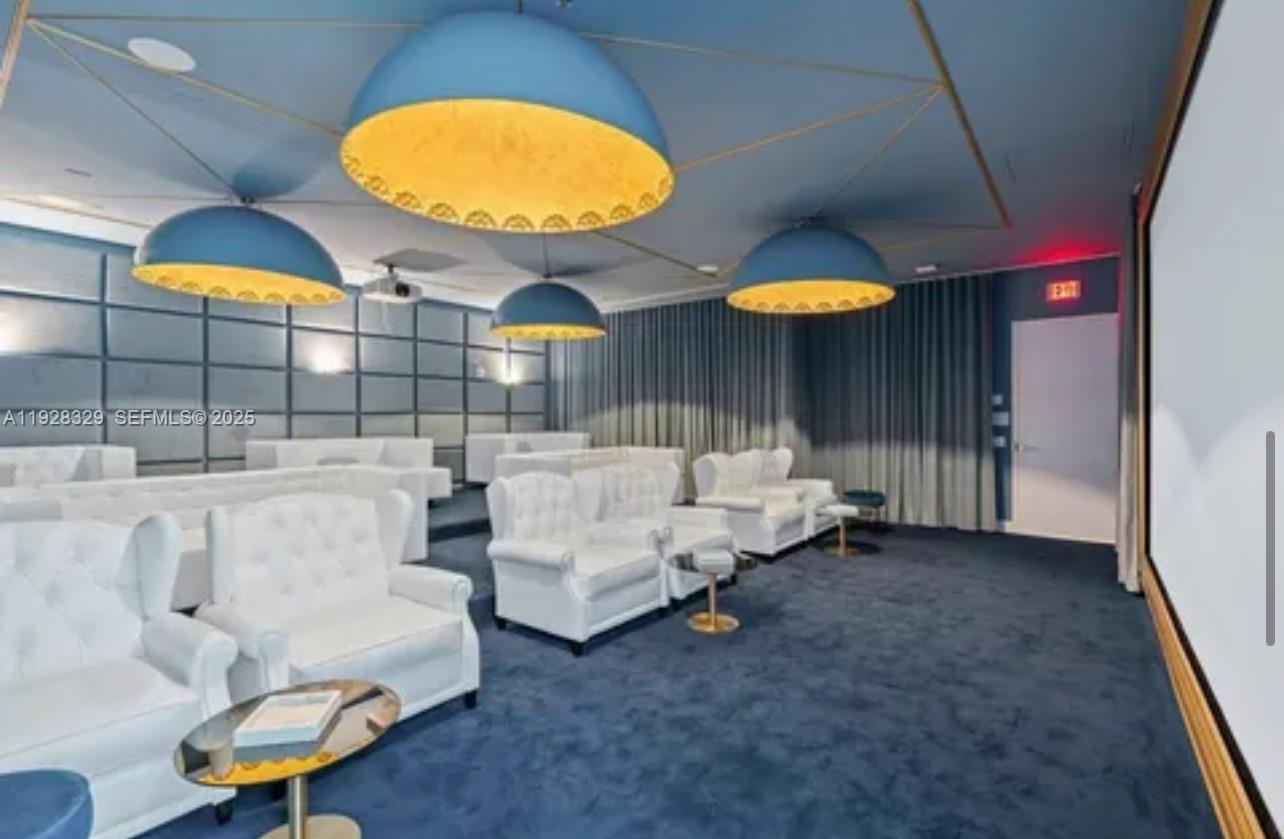 2000 Metropica Way, Unit 1701 Sunrise, FL 33323 - Photo 21 of 32 a living room with furniture and a fireplace