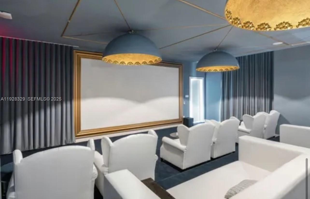 2000 Metropica Way, Unit 1701 Sunrise, FL 33323 - Photo 22 of 32 a living room with furniture and a large window