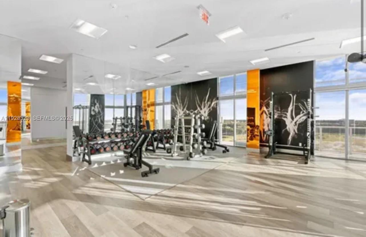 2000 Metropica Way, Unit 1701 Sunrise, FL 33323 - Photo 23 of 32 a view of a room with gym equipment