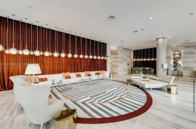 a view of a livingroom with furniture and wooden floor