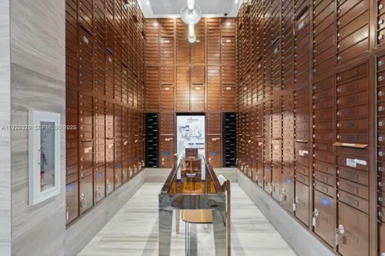 2000 Metropica Way, Unit 1701 Sunrise, FL 33323 - Photo 25 of 32 a view of a brick building next to a yard