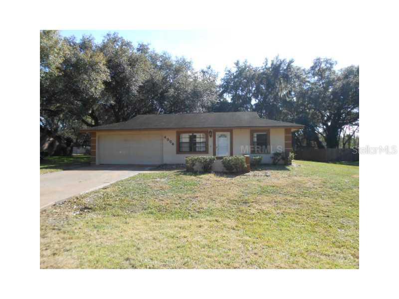 4354 Diamond Road Southwest Winter Haven, FL 33880 - Photo 1 of 1 a house view with swimming pool and wooden fence