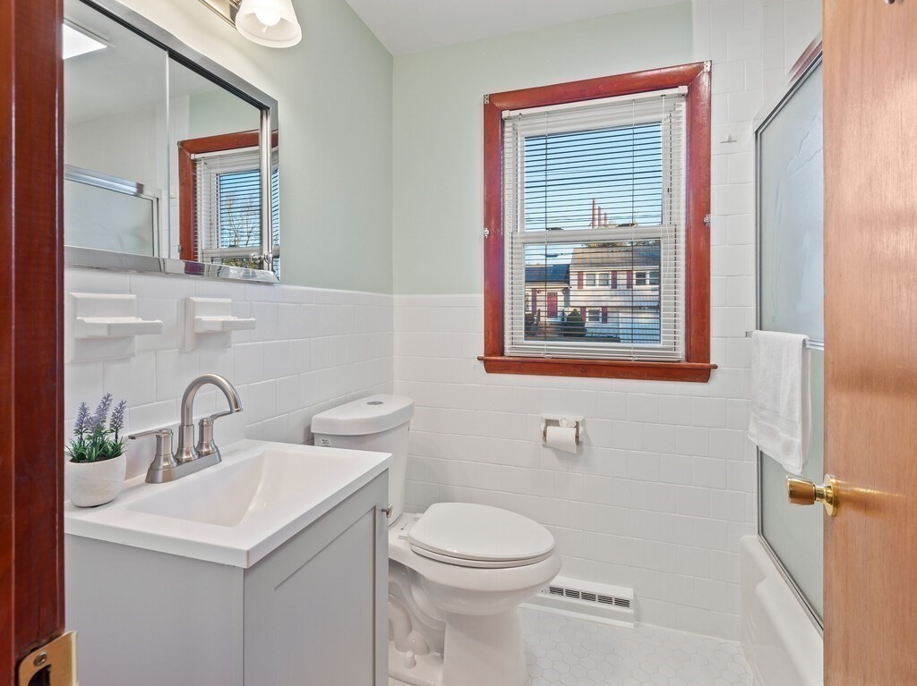 1 Foley Drive Framingham, MA 01701 - Photo 11 of 17 a bathroom with a toilet sink and mirror